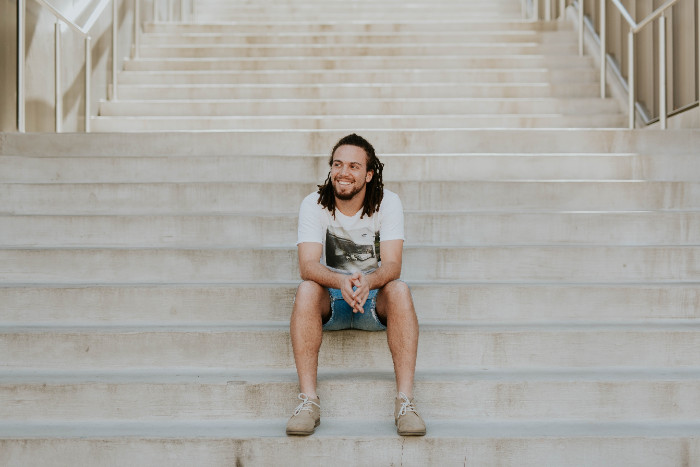 young man sitting on staircase